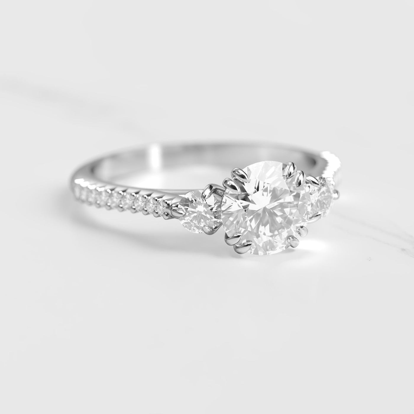 Round half pave diamond ring with accent stones