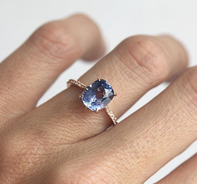 Cushion-cut blue sapphire ring with diamonds