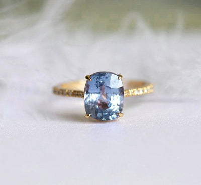 Cushion-cut blue sapphire ring with diamonds