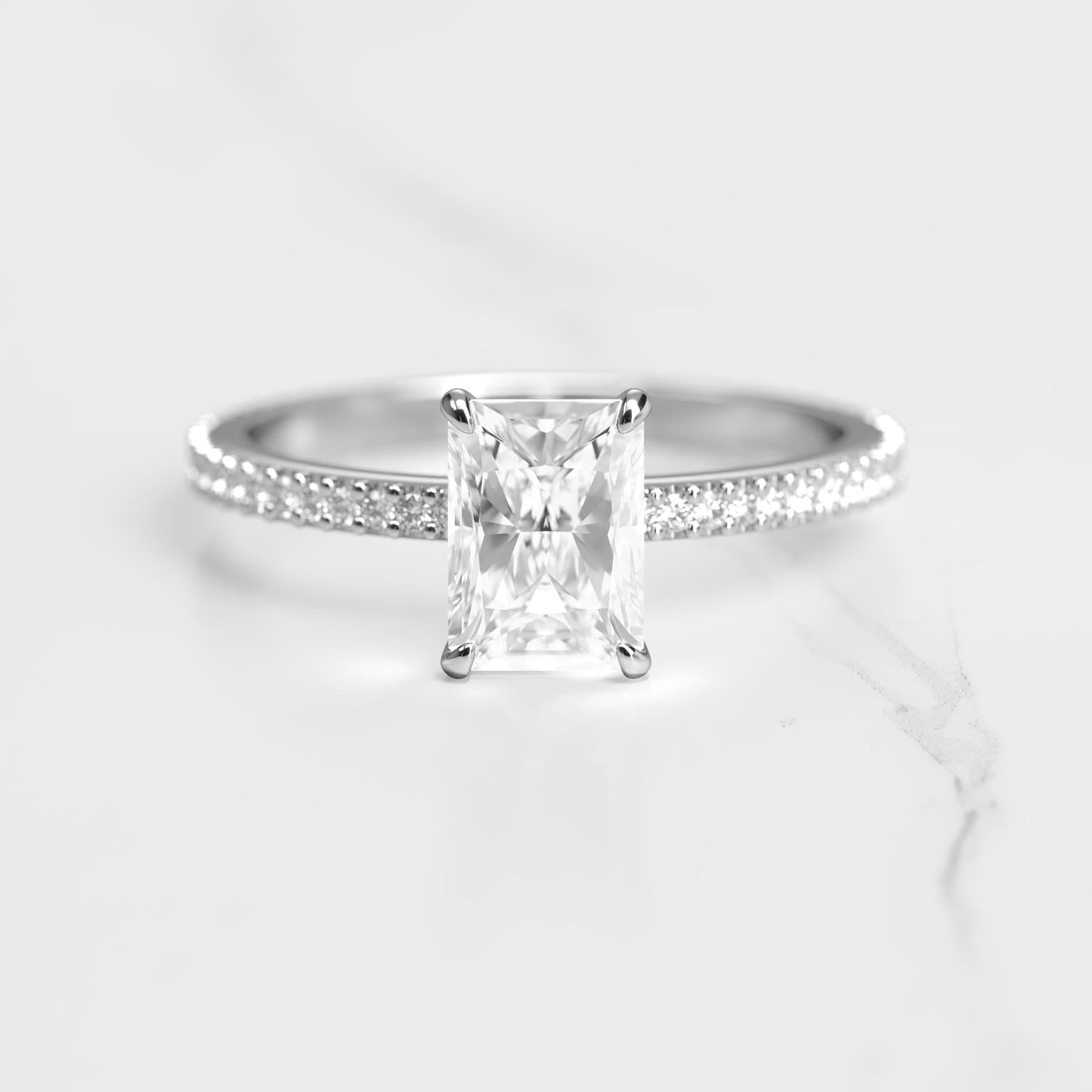 Radiant-cut half pave tapered diamond eternity ring