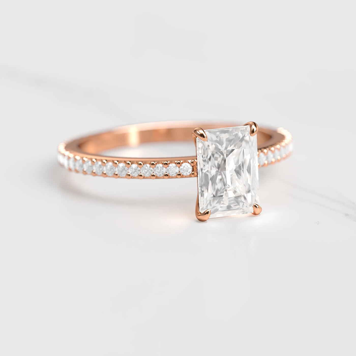 Radiant-cut half pave tapered diamond eternity ring