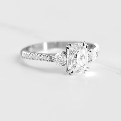 Radiant half pave white moissanite ring with accent stones