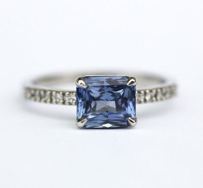 Radiant-cut blue sapphire ring with diamonds