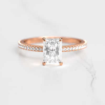 Radiant-cut half pave tapered moissanite eternity ring