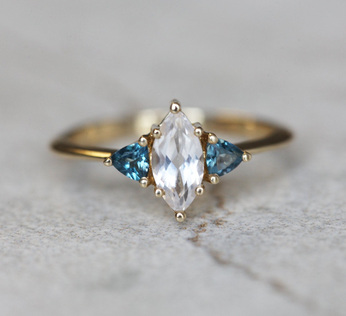 Marquise-cut white sapphire ring with topaz gemstones