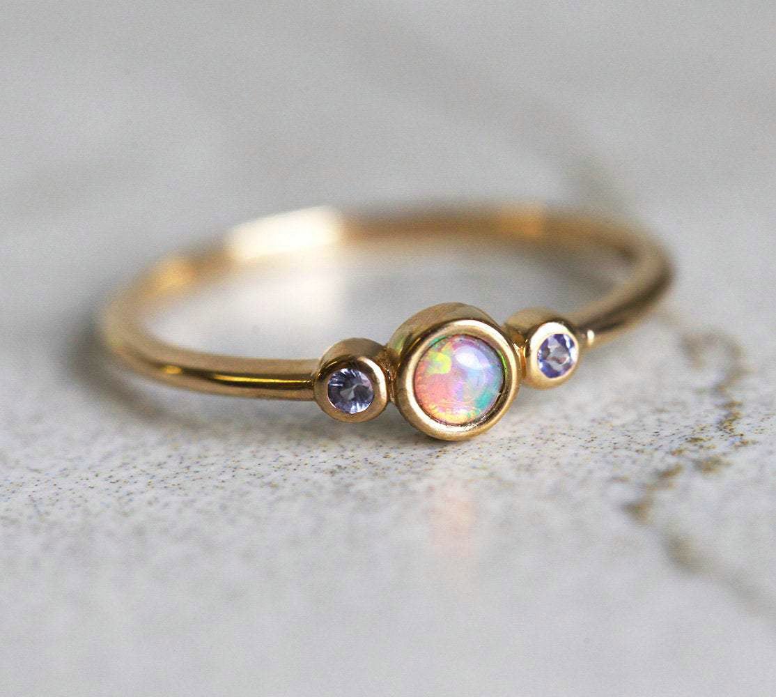 3-Stone Round Opal Ring with 2 Side Round Tanzanite Gemstones