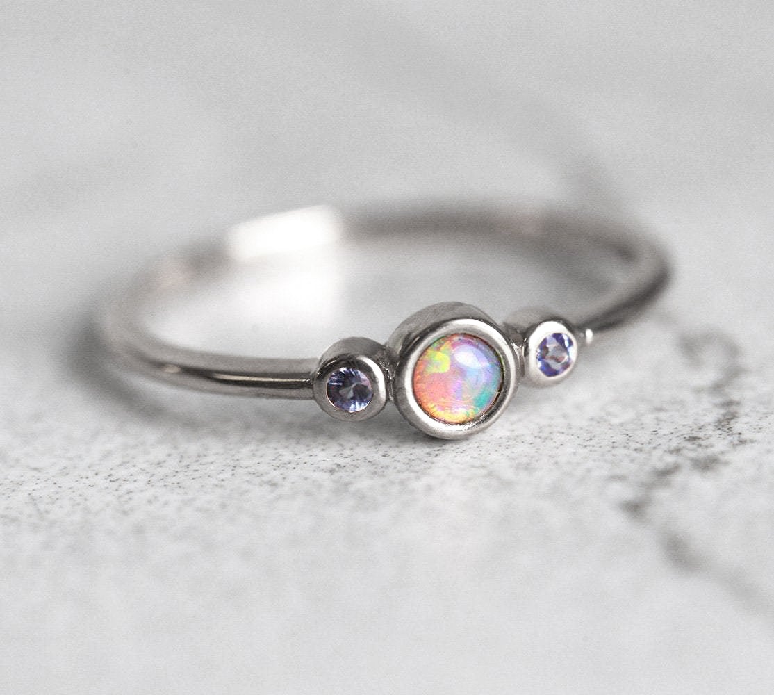 3-Stone Round Opal Ring with 2 Side Round Tanzanite Gemstones