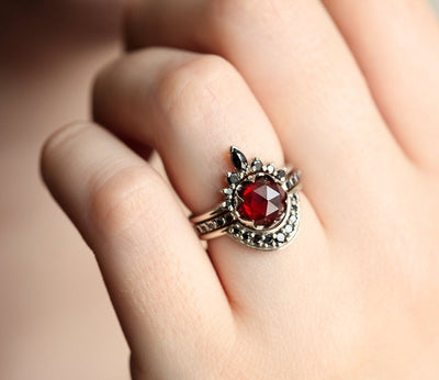 Unique Round Garnet Ring Set with Side Marquise Cut and Round Black Diamonds