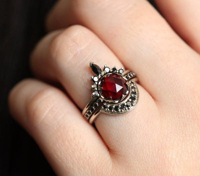 Unique Round Garnet Ring Set with Side Marquise Cut and Round Black Diamonds