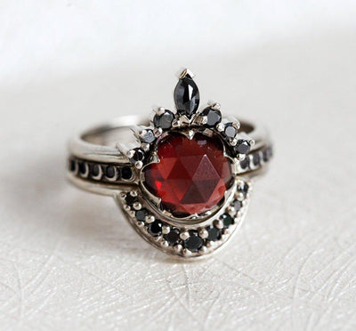 Unique Round Garnet Ring Set with Side Marquise Cut and Round Black Diamonds