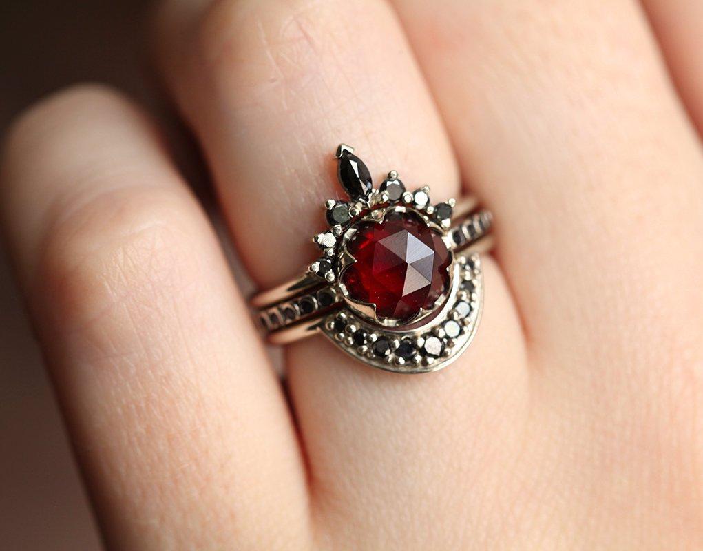 Unique Round Garnet Ring Set with Side Marquise Cut and Round Black Diamonds