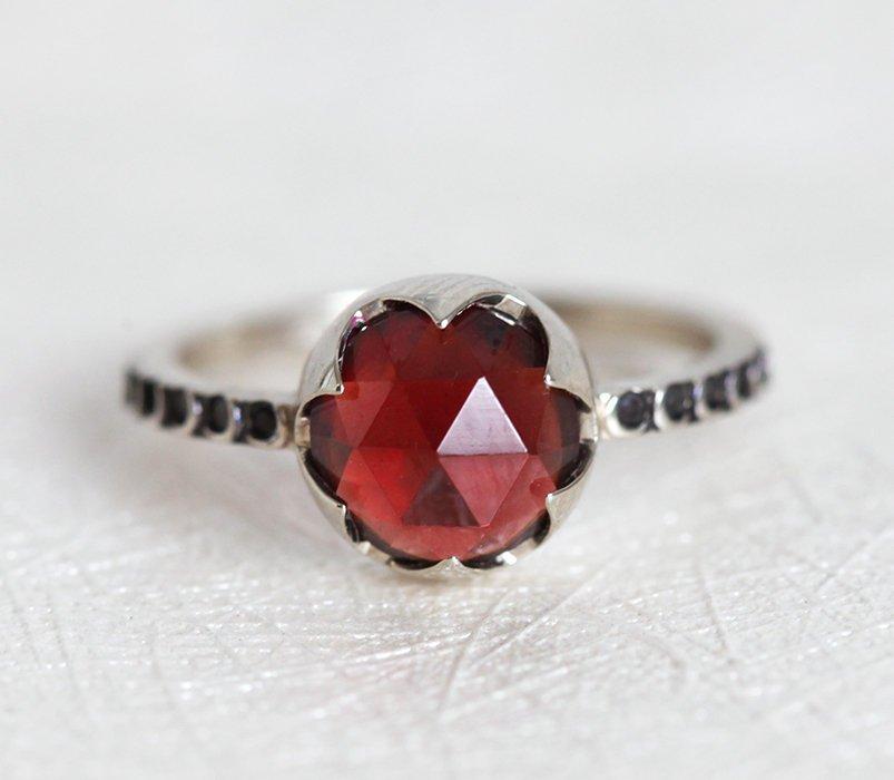 Unique Round Garnet Ring Set with Side Marquise Cut and Round Black Diamonds