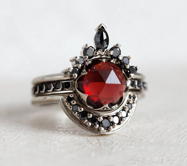 Unique Round Garnet Ring Set with Side Marquise Cut and Round Black Diamonds