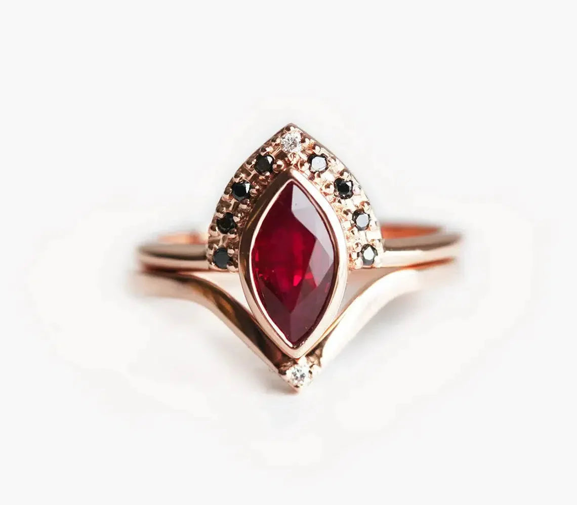 Marquise Cut Ruby Engagement Ring Set with Round Black and White Diamonds Featuring A Chevron Band