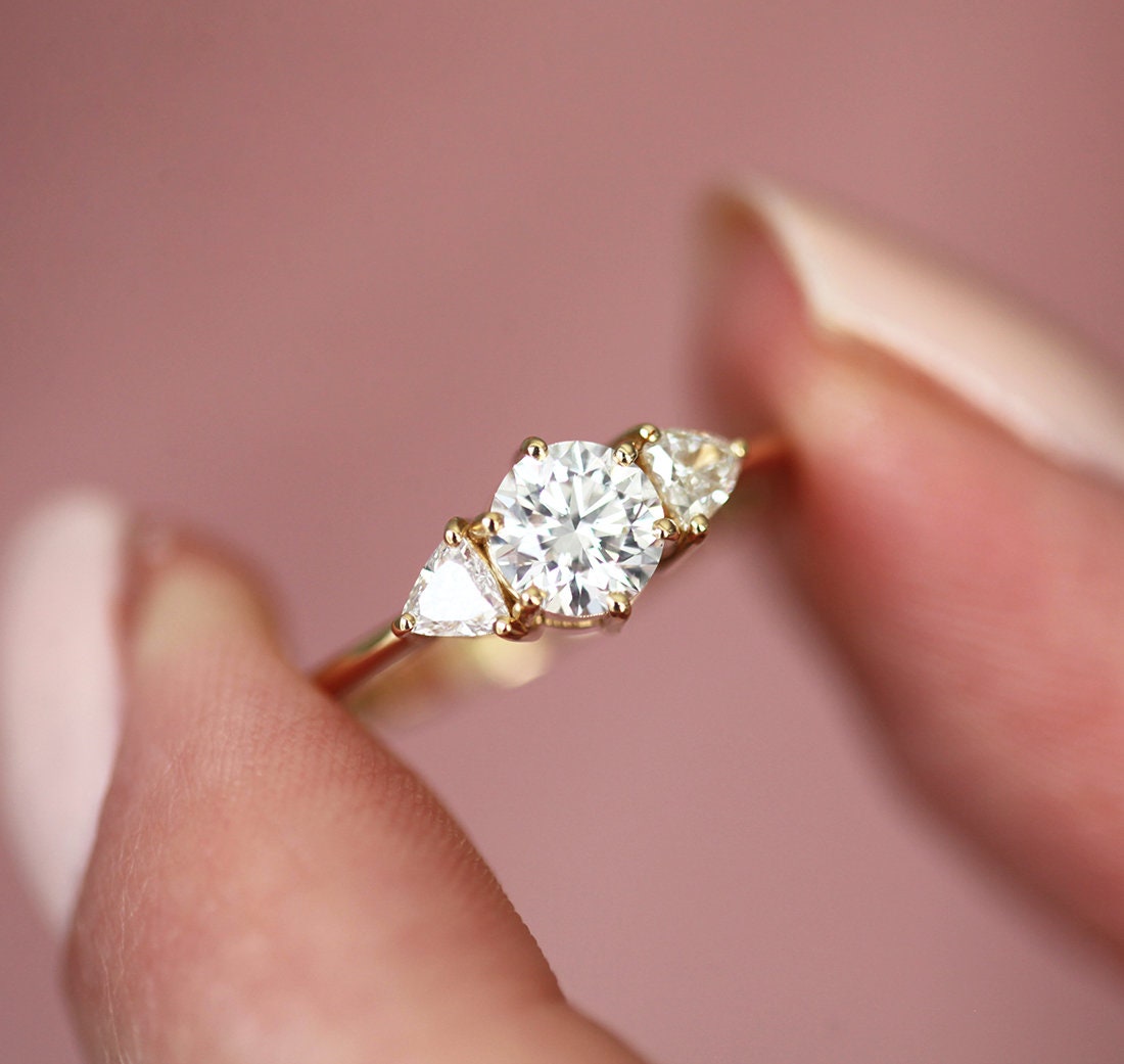 Round and trillion-cut diamond ring