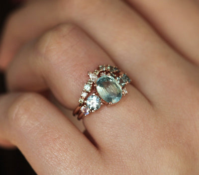 Oval light green sapphire cluster ring with moonstone and diamond gemstones