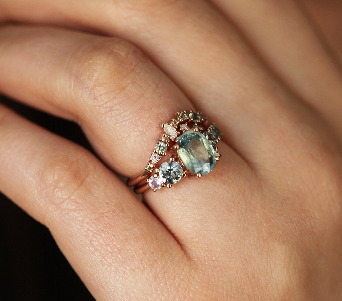 Oval light green sapphire cluster ring with moonstone and diamond gemstones