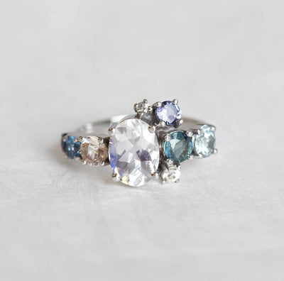 Oval Moonstone Cluster Ring with Side White Diamons, Tanzanite, Sapphire and Aquamarine Gemstones