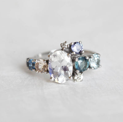 Oval Moonstone Cluster Ring with Side White Diamons, Tanzanite, Sapphire and Aquamarine Gemstones