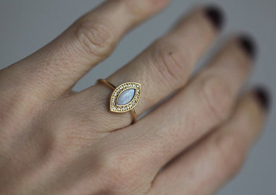 Marquise-Cut White Opal Halo Ring with Round Diamonds