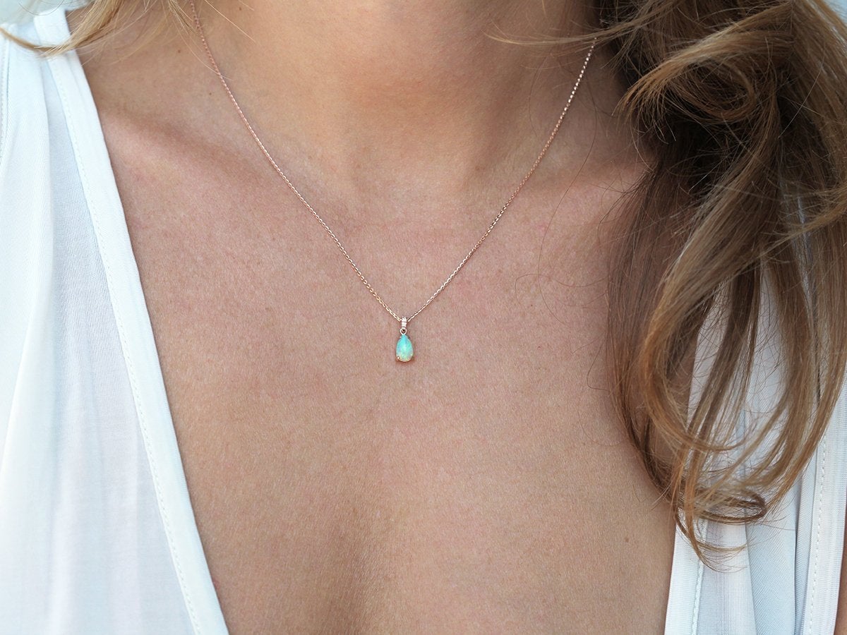 Gold chain necklace with pear-shaped australian opal and white round diamonds
