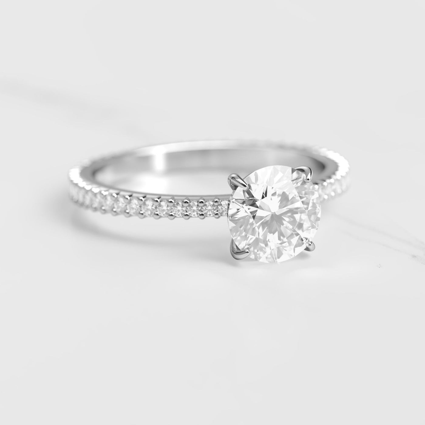 Round full pave tapered moissanite ring