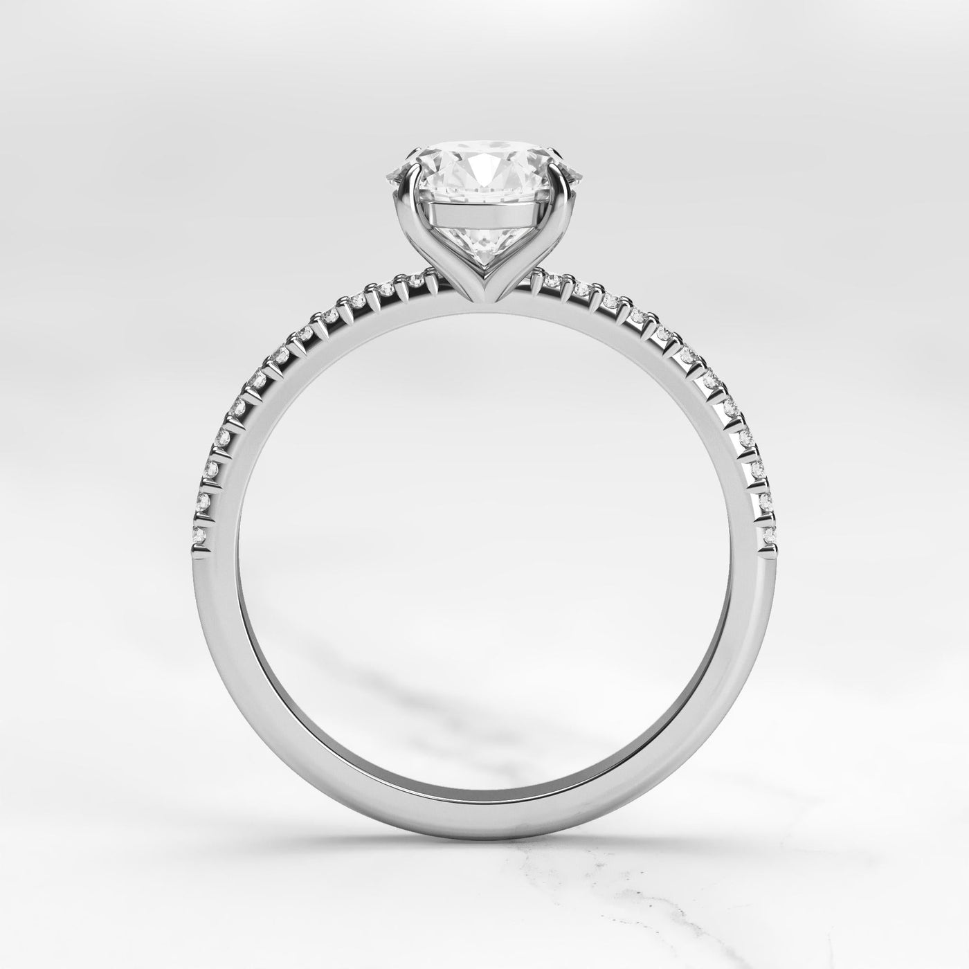 Round half pave tapered diamond eternity ring
