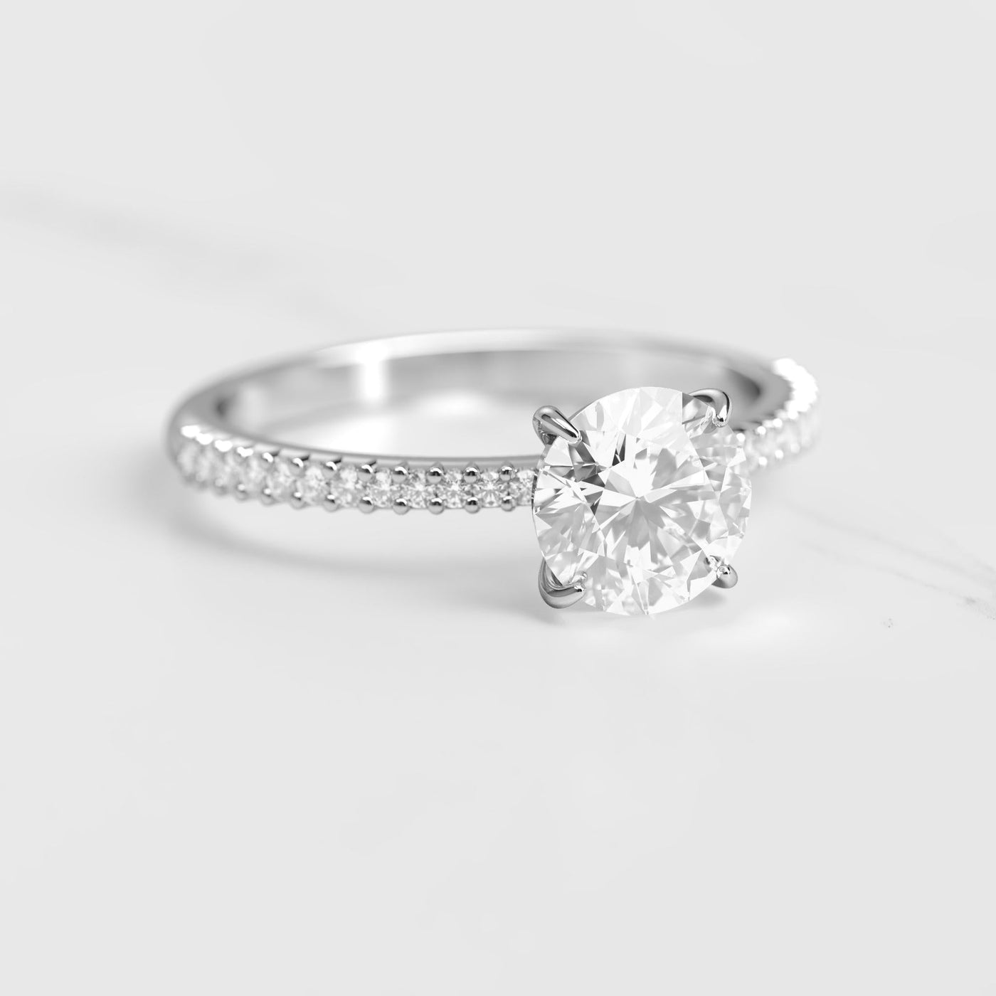 Round half pave tapered diamond eternity ring