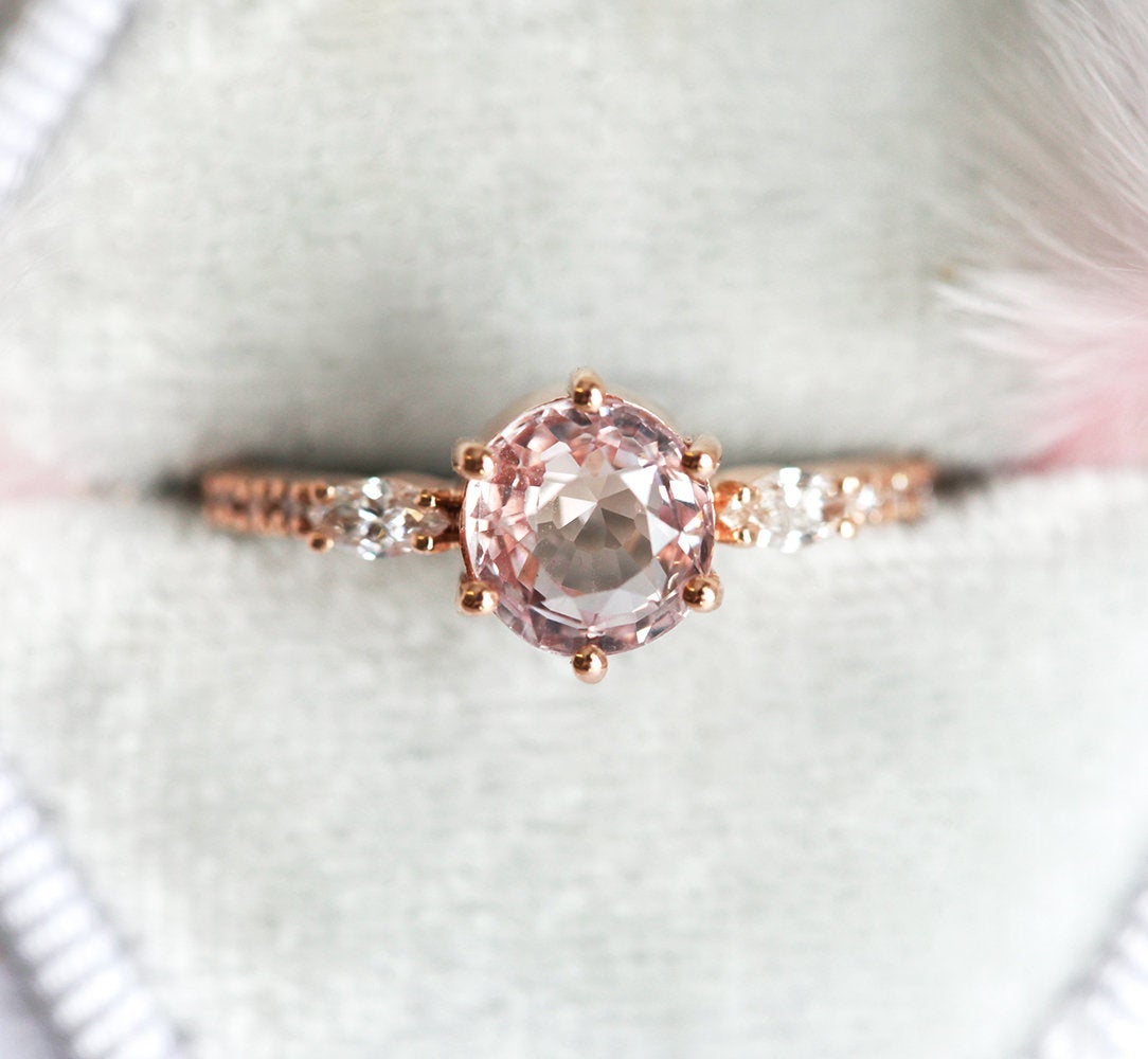 Round peach pink sapphire ring with diamonds