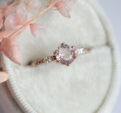 Round peach pink sapphire ring with diamonds