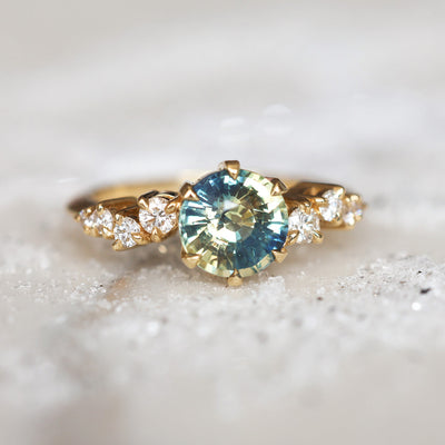 Round bicolor sapphire and diamond cluster ring