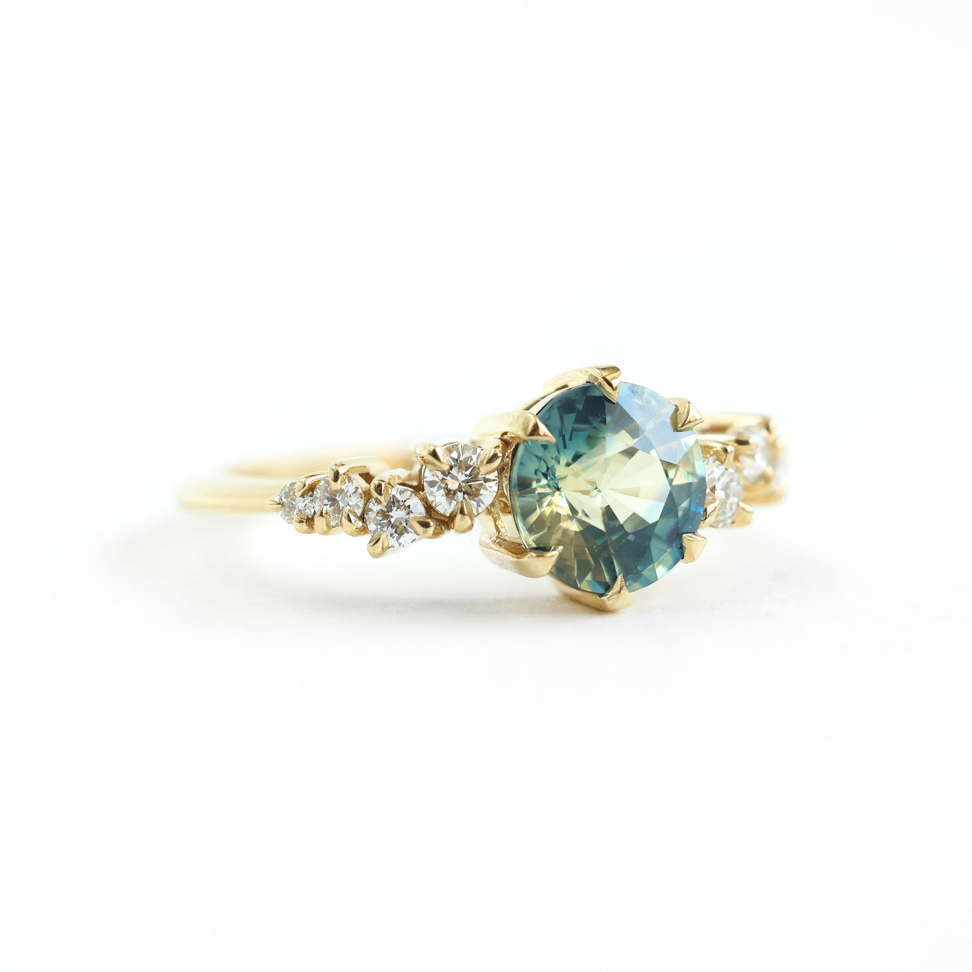 Round bicolor sapphire and diamond cluster ring