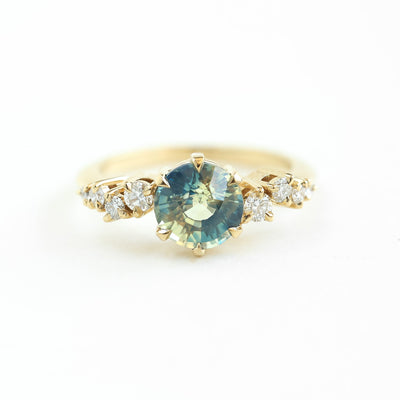 Round bicolor sapphire and diamond cluster ring