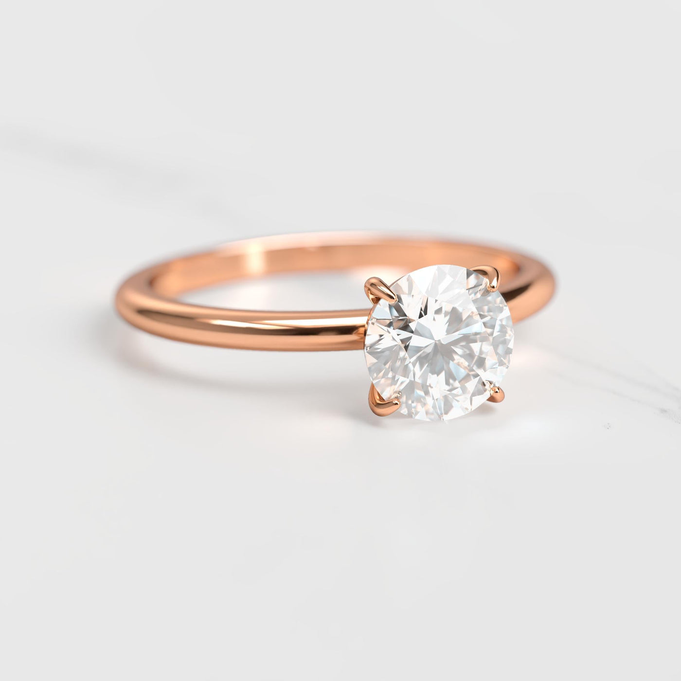 Round tapered solitaire moissanite ring