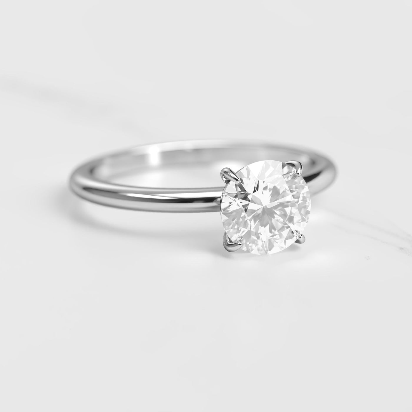 Round tapered solitaire moissanite ring