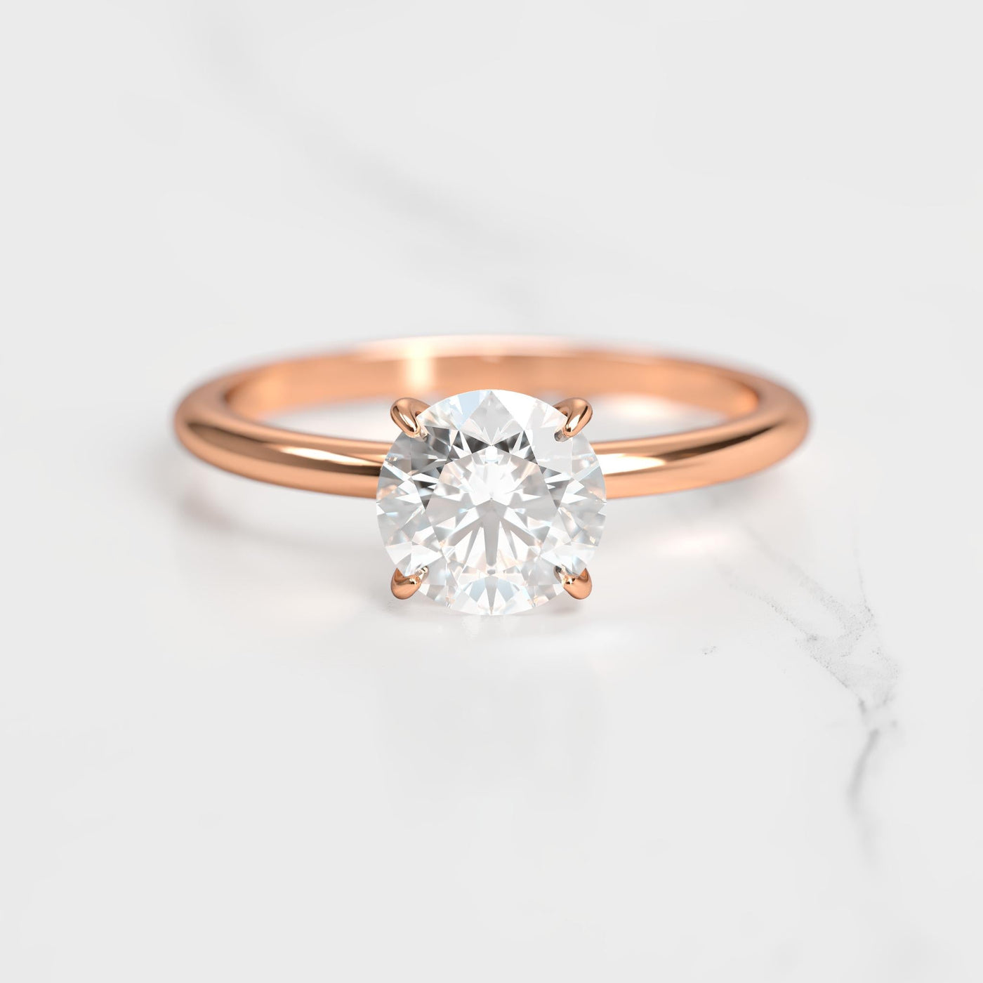 Round tapered solitaire moissanite ring