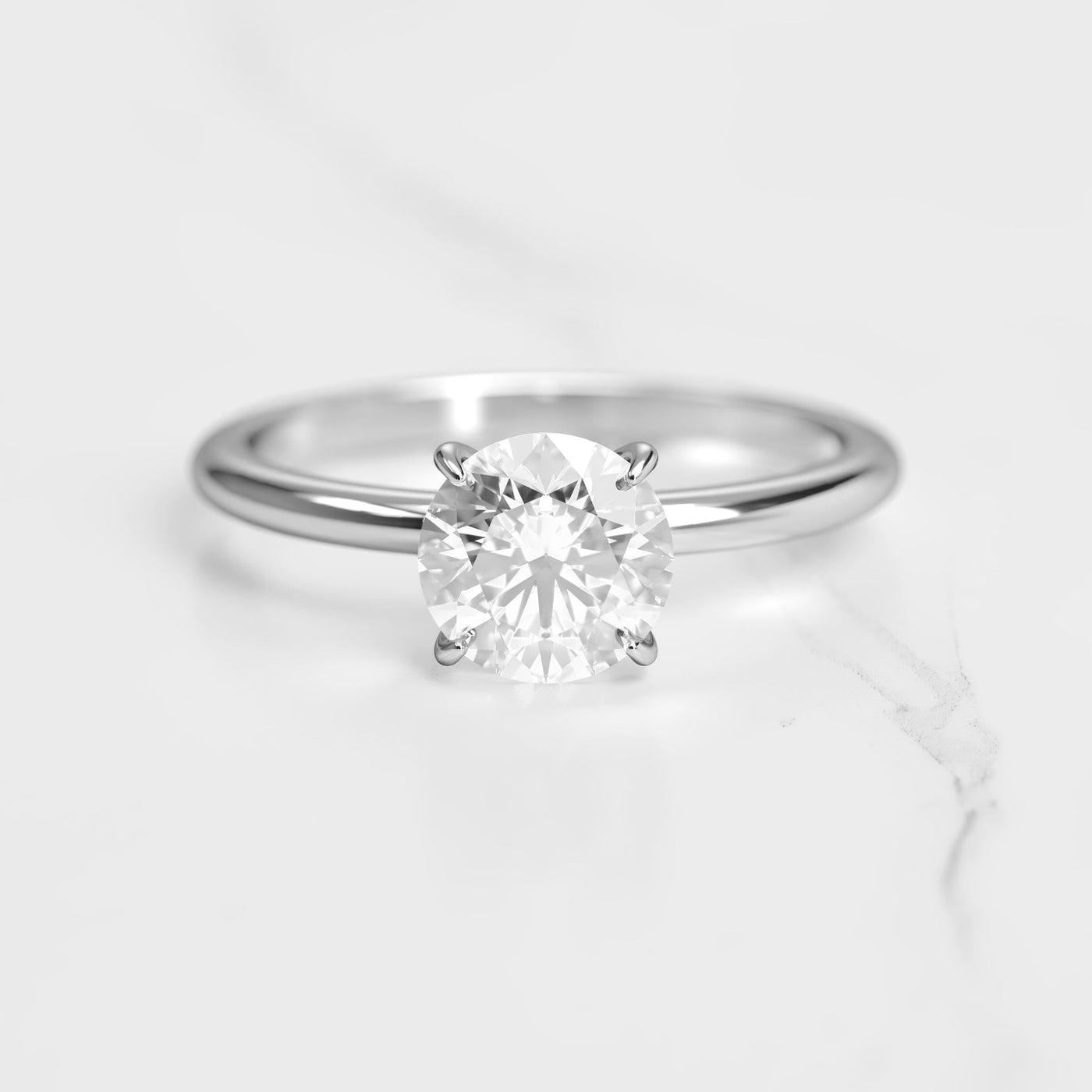 Round tapered solitaire moissanite ring