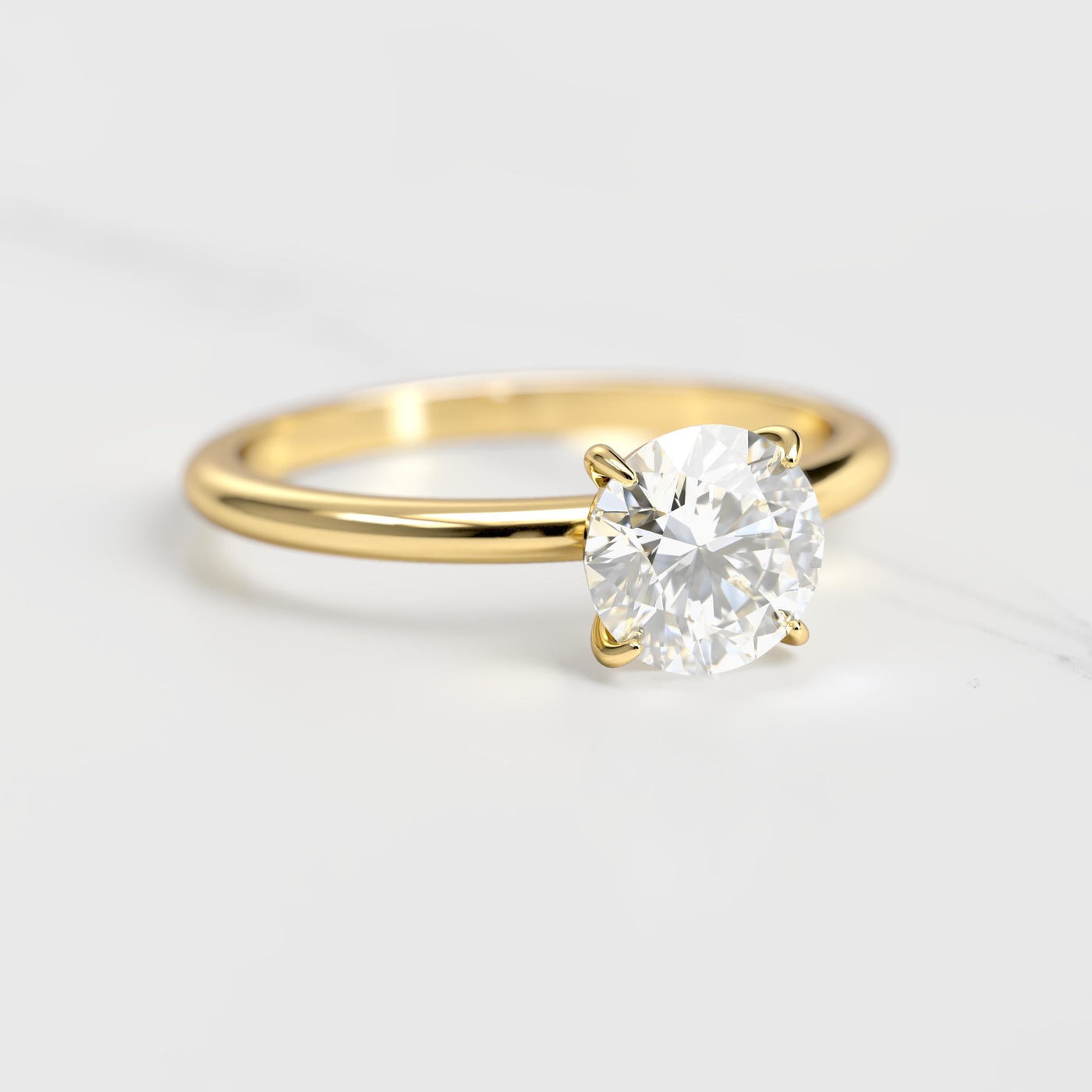 Round tapered solitaire moissanite ring