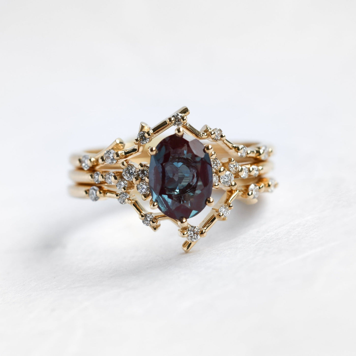 Oval Alexandrite Ring Set with Upper and Lower Bands holding Round White Diamonds
