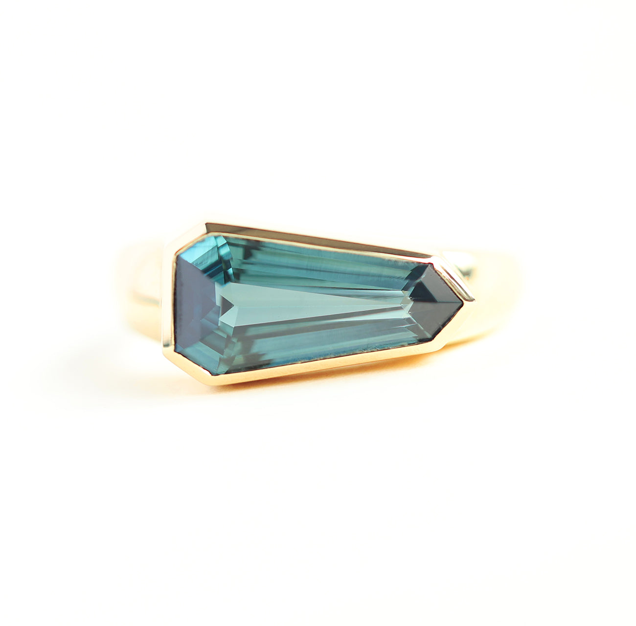 Shield-cut teal sapphire ring