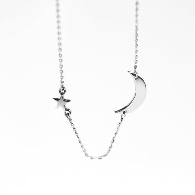 Gold star and moon necklace