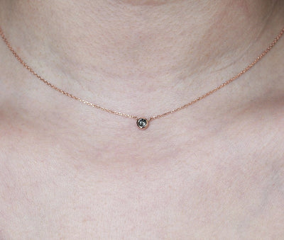 Gold chain with round salt and pepper diamond
