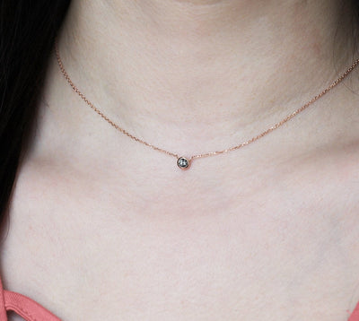 Gold chain with round salt and pepper diamond