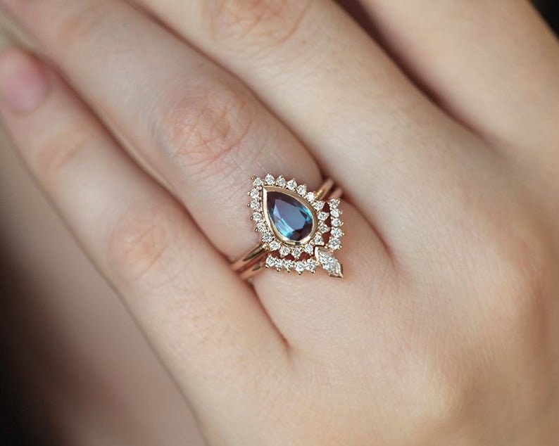 Blue Pear Alexandrite Ring with plenty of smaller White Diamonds on the Side