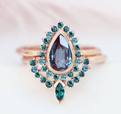 Blue Pear Alexandrite Ring with plenty of smaller Teal Blue Diamonds on the Side