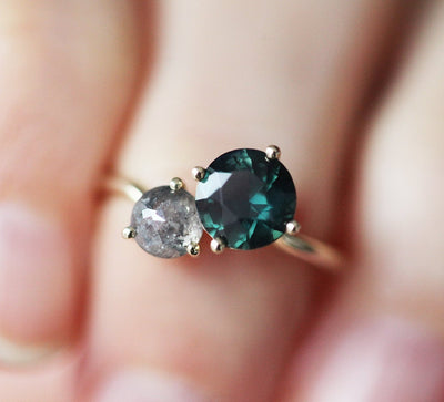 Round teal sapphire and round salt and pepper diamond planet conjunction ring