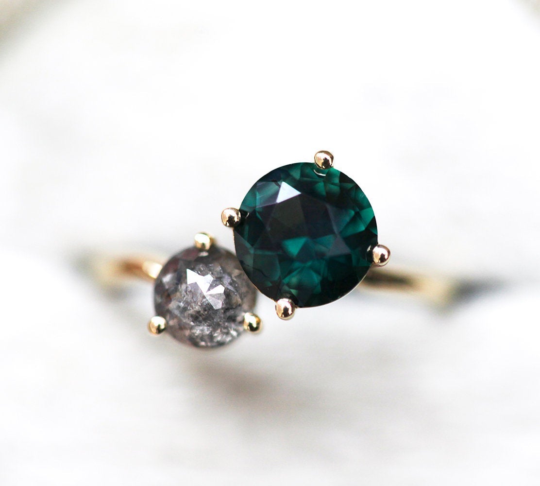 Round teal sapphire and round salt and pepper diamond planet conjunction ring