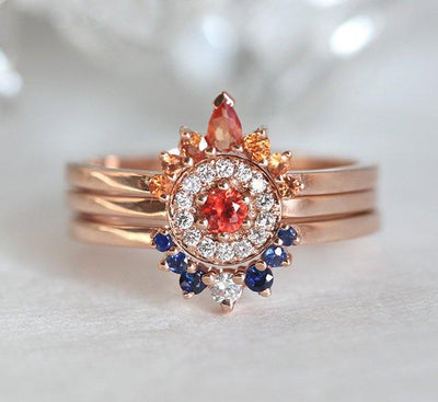 Round white diamond cluster ring with sapphire gemstones