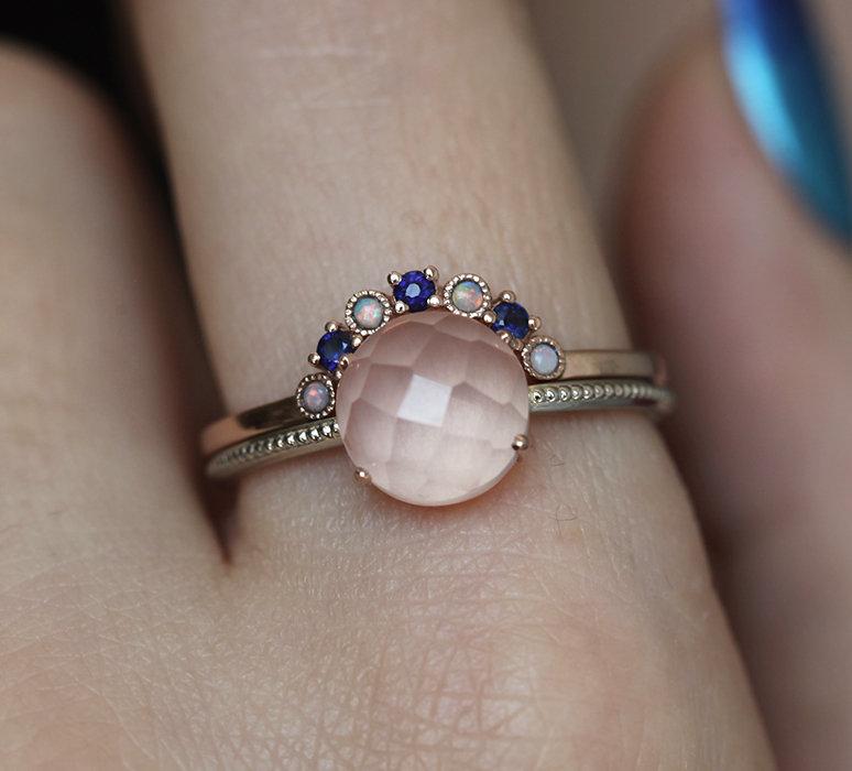 Nested round blue sapphire ring with opal gemstones