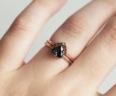 Trillion-cut teal sapphire and white round diamond ring set
